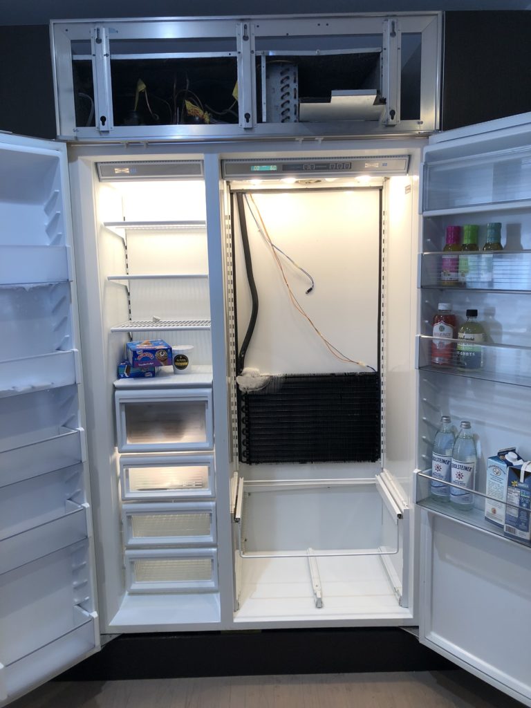 A refrigerator with ice buildup.